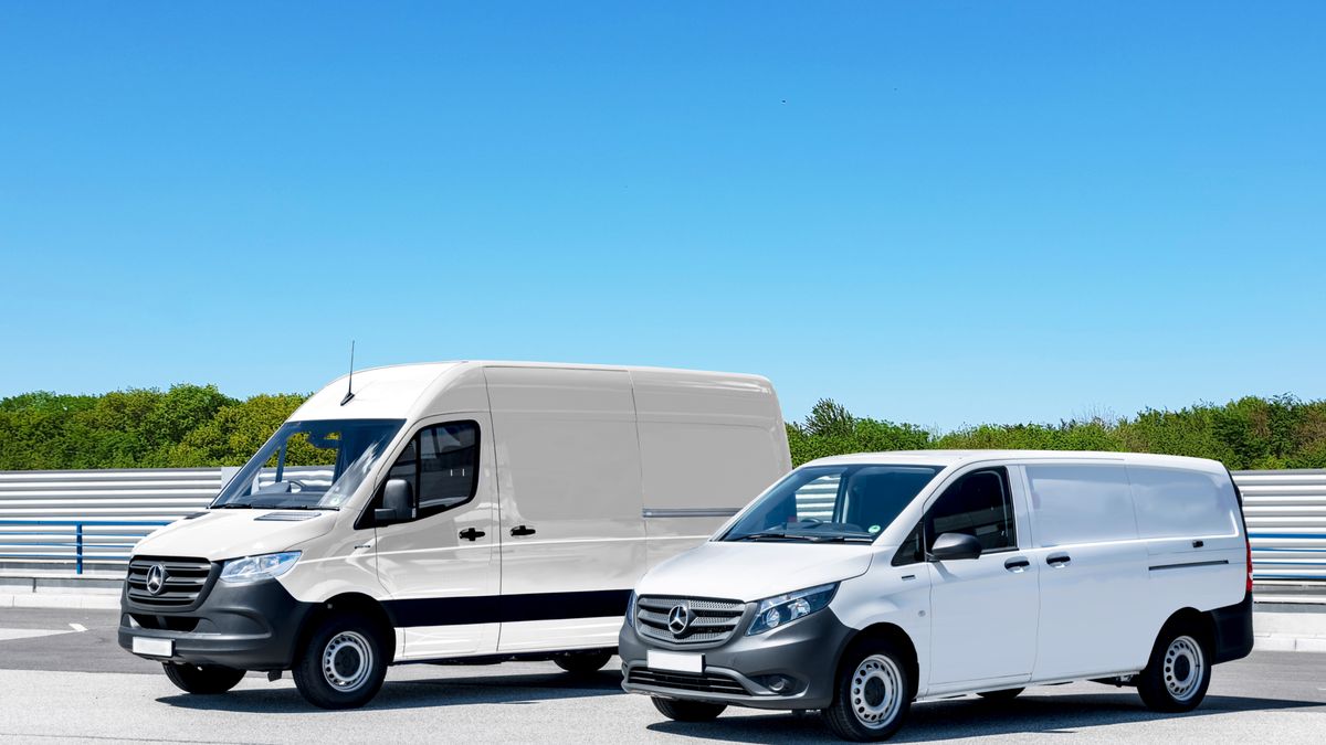 White commercial delivery vans parked in a business lot